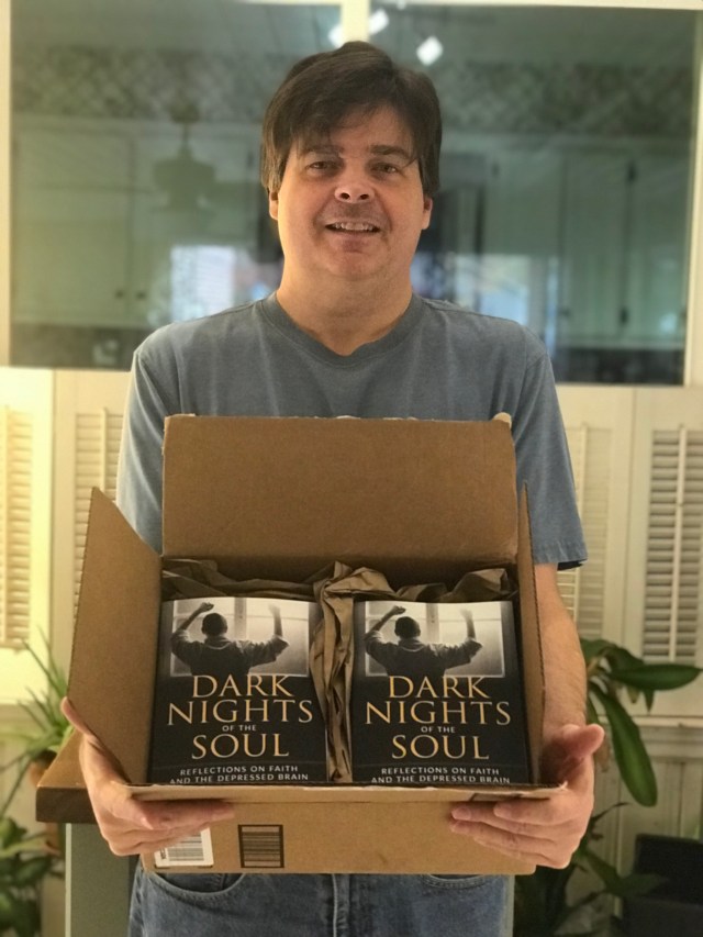 holding my box of author copies