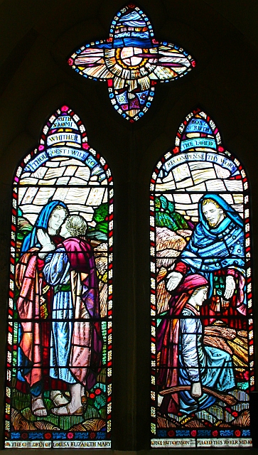 Stained glass windows. On the left, Ruth pledges to stay with Naomi. On the right, Boaz shows kindness to Ruth.